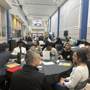 Students and employers network at event.